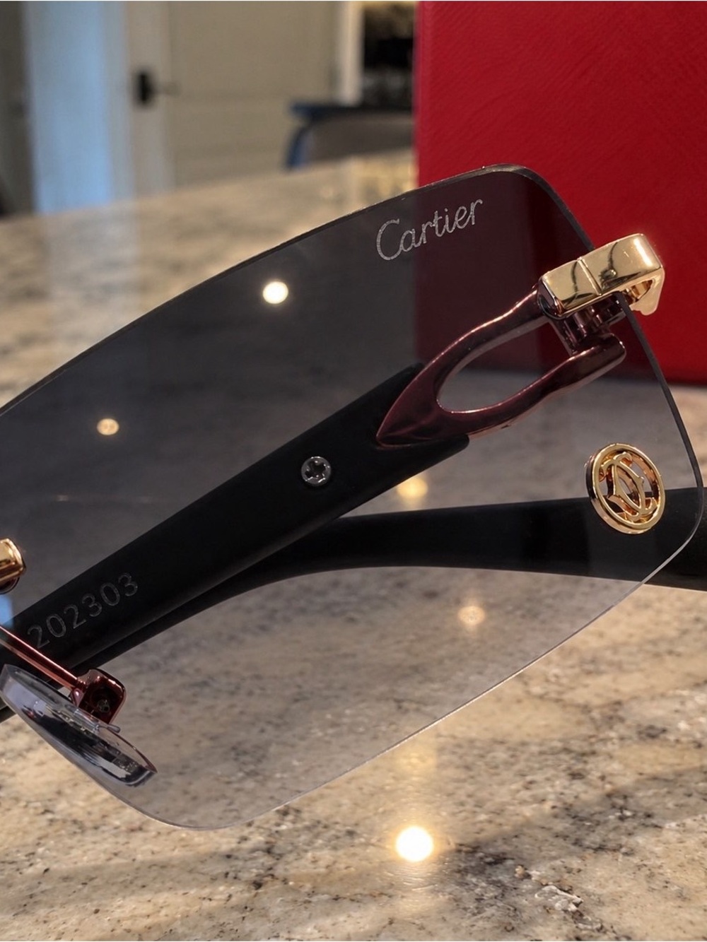 Cartier Black Rimless Sunglasses with Gold Accents